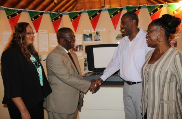 St. Kitts and Nevis Ambassador to the Organisation of American States His Excellency Dr. Everson Hull (middle left), handing over an Epson Expression 11000XL photographic scanner to Devon Liburd on behalf of the Nevis Historical and Conservation Society on April 12, 2016, at the Museum of Nevis History for use in archiving historical data. Looking on are his wife Dr. Sandra Cooke-Hull (extreme left) and Archivist at the Museum of Nevis History Gail Dore (extreme right)